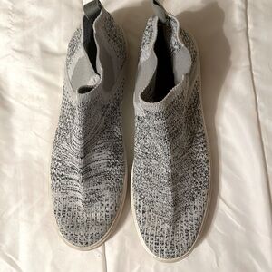 Slip on shoes with black threading.